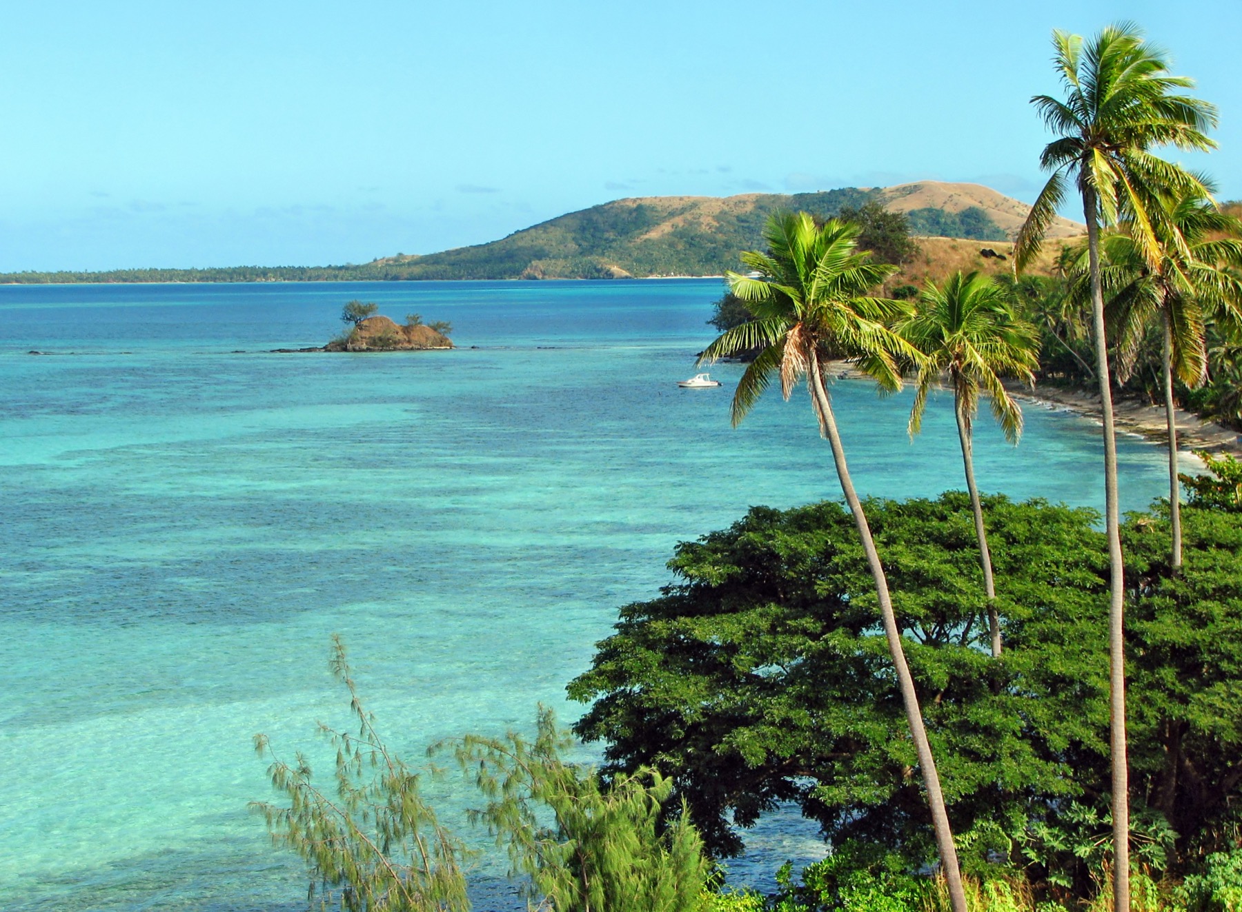 Fiji coastline viewed across clear water